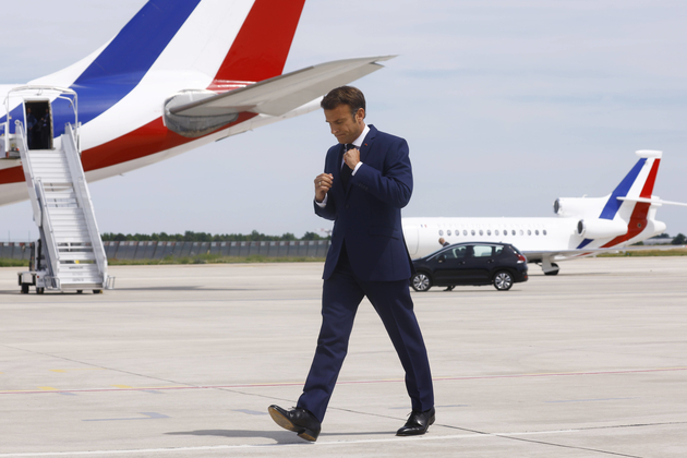 French President Macron arrives to deliver a statement at Orly airport before his departure to Romania